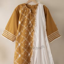 Mustard yellow dress with intricate white patterns Code 316