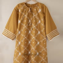 Mustard yellow dress with intricate white patterns Code 316